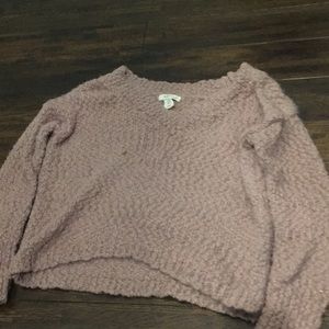 A pinkish purple sweater
